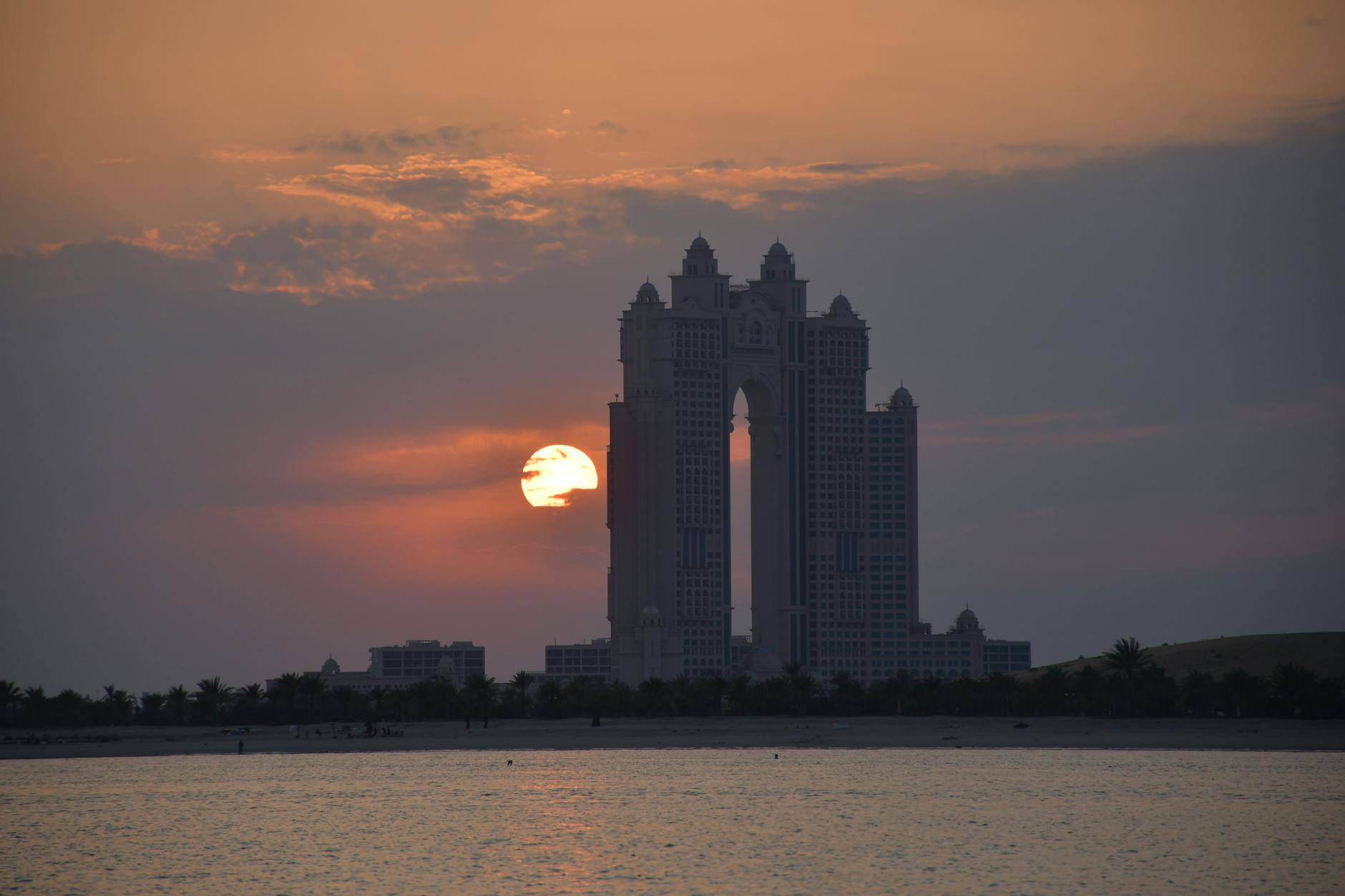 silhouette of city buildings during sunset